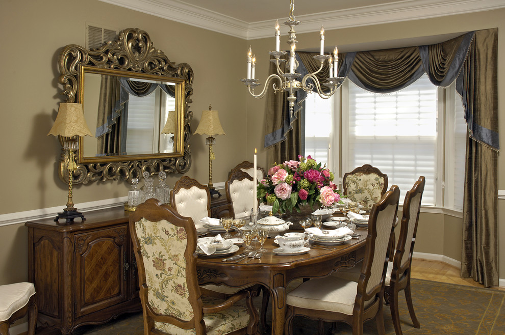 Inspiration for a traditional dining room in DC Metro with beige walls and medium hardwood floors.