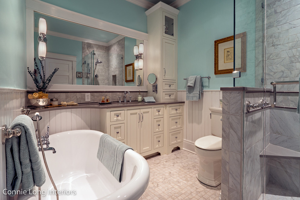 This is an example of a small arts and crafts master bathroom in Nashville with shaker cabinets, white cabinets, a freestanding tub, an open shower, a two-piece toilet, white tile, porcelain tile, blue walls, porcelain floors, an undermount sink and engineered quartz benchtops.