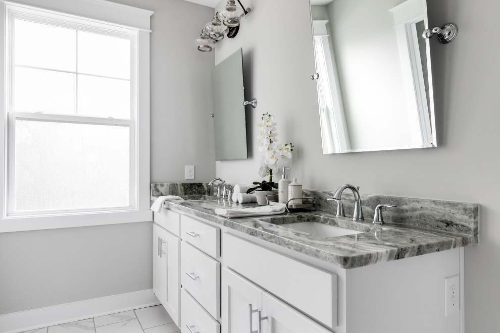 Photo of a large arts and crafts master bathroom in Richmond with recessed-panel cabinets, white cabinets, a curbless shower, a two-piece toilet, gray tile, ceramic tile, grey walls, ceramic floors, an undermount sink, granite benchtops, white floor, grey benchtops, an enclosed toilet, a single vanity and a built-in vanity.