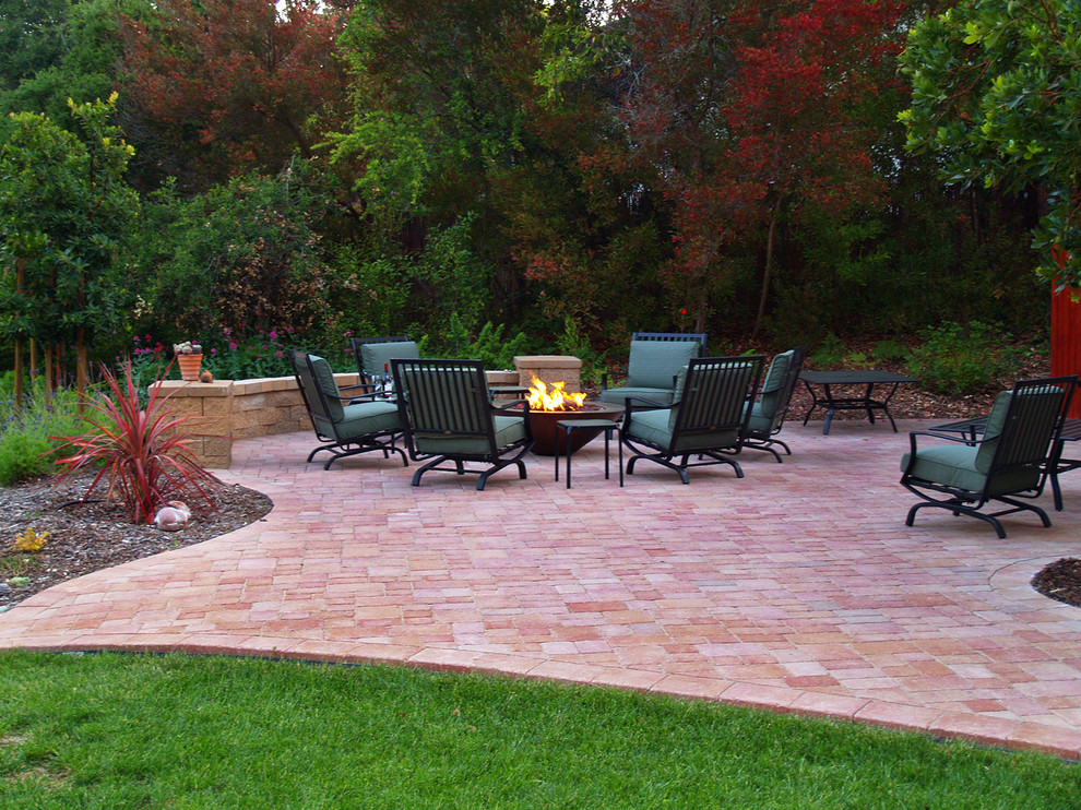 Design ideas for a contemporary backyard patio in Santa Barbara with a fire feature and concrete pavers.