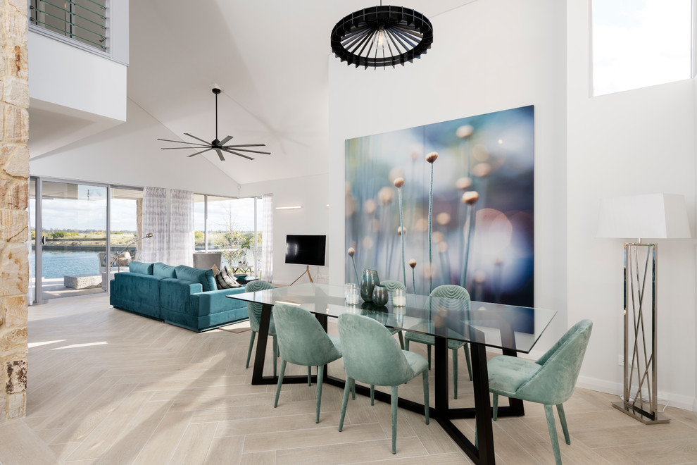 Contemporary open plan dining in Perth with light hardwood floors, beige floor and white walls.