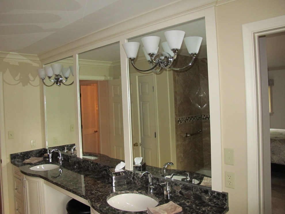 Inspiration for a transitional 3/4 beige tile and porcelain tile porcelain tile tub/shower combo remodel with beige walls and granite countertops