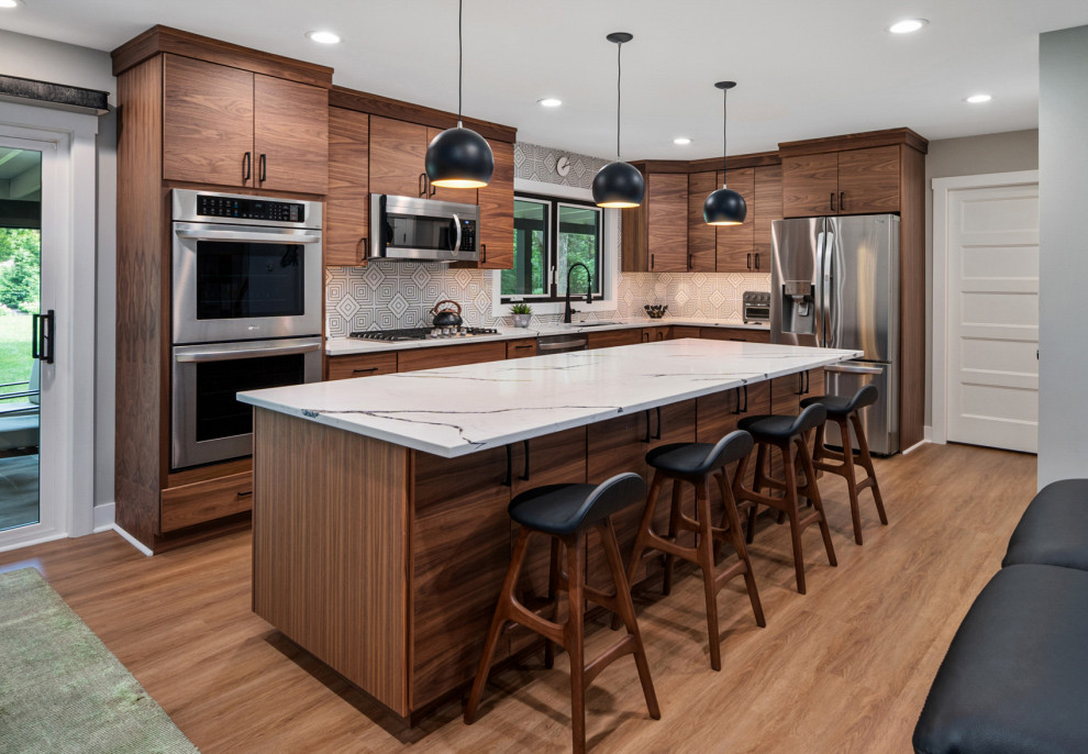 Inspiration for a contemporary kitchen remodel in Baltimore with flat-panel cabinets, medium tone wood cabinets, quartz countertops, black backsplash, ceramic backsplash and an island