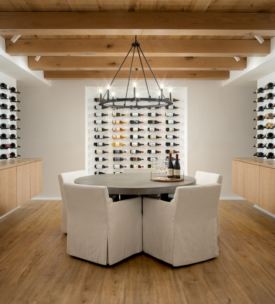 Mid-sized contemporary wine cellar in DC Metro with display racks.