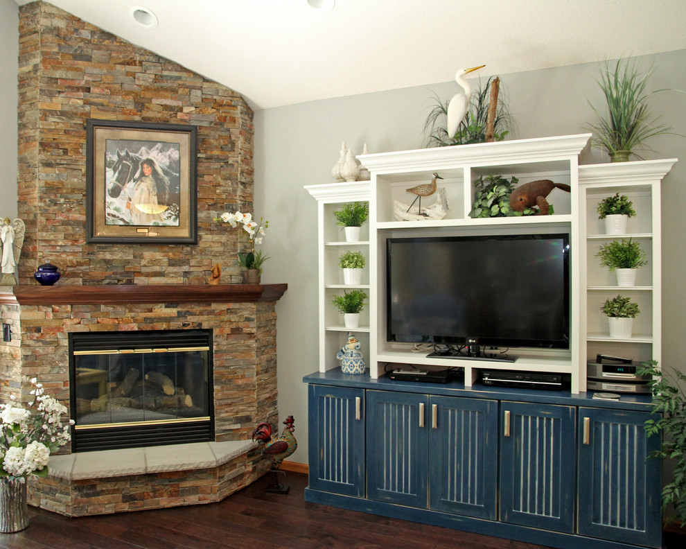 Mid-sized traditional open concept living room in Minneapolis with dark hardwood floors, a corner fireplace, a stone fireplace surround and grey walls.