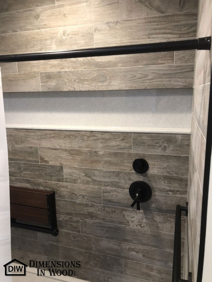 This is an example of a mid-sized contemporary master bathroom in Other with flat-panel cabinets, white cabinets, an open shower, a two-piece toilet, white tile, wood-look tile, white walls, ceramic floors, an undermount sink, onyx benchtops, an open shower, white benchtops, a shower seat, a double vanity and a built-in vanity.