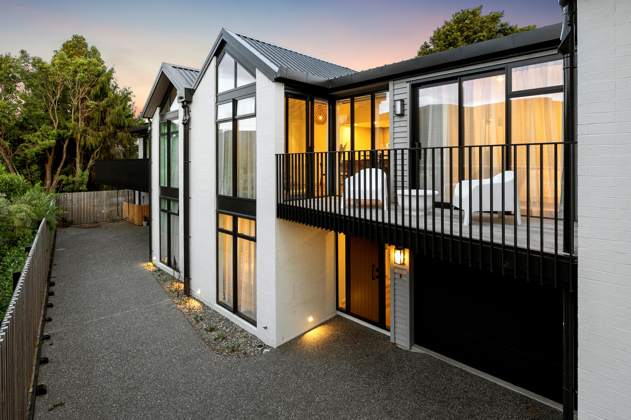 A contemporary upmarket townhouse development with 3 double storey units