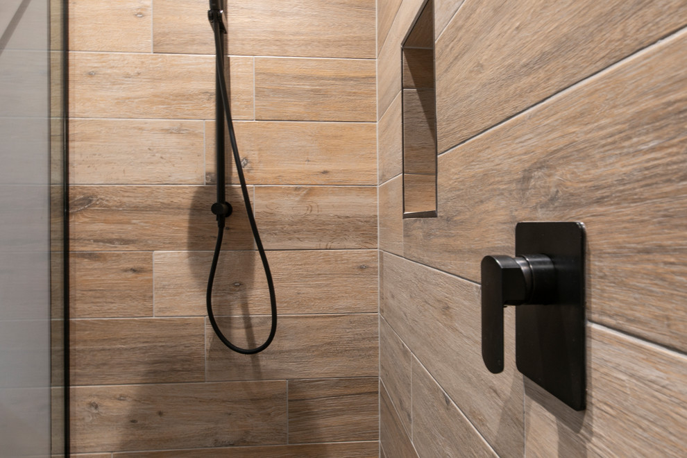 Inspiration for a mid-sized contemporary master bathroom in Auckland with a double shower, a two-piece toilet, beige tile, purple walls, dark hardwood floors, a wall-mount sink, brown floor and an open shower.