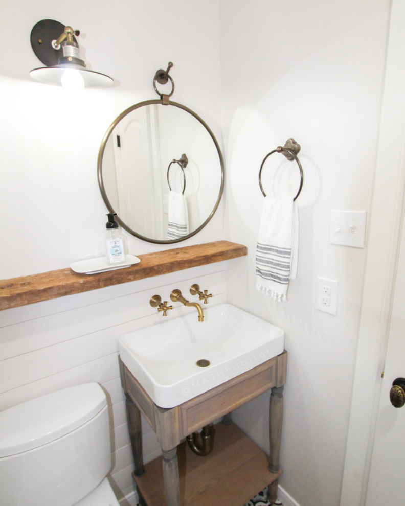 Inspiration for a small country 3/4 bathroom in Dallas with furniture-like cabinets, light wood cabinets, a one-piece toilet, black and white tile, white walls, ceramic floors, a pedestal sink, white floor and white benchtops.