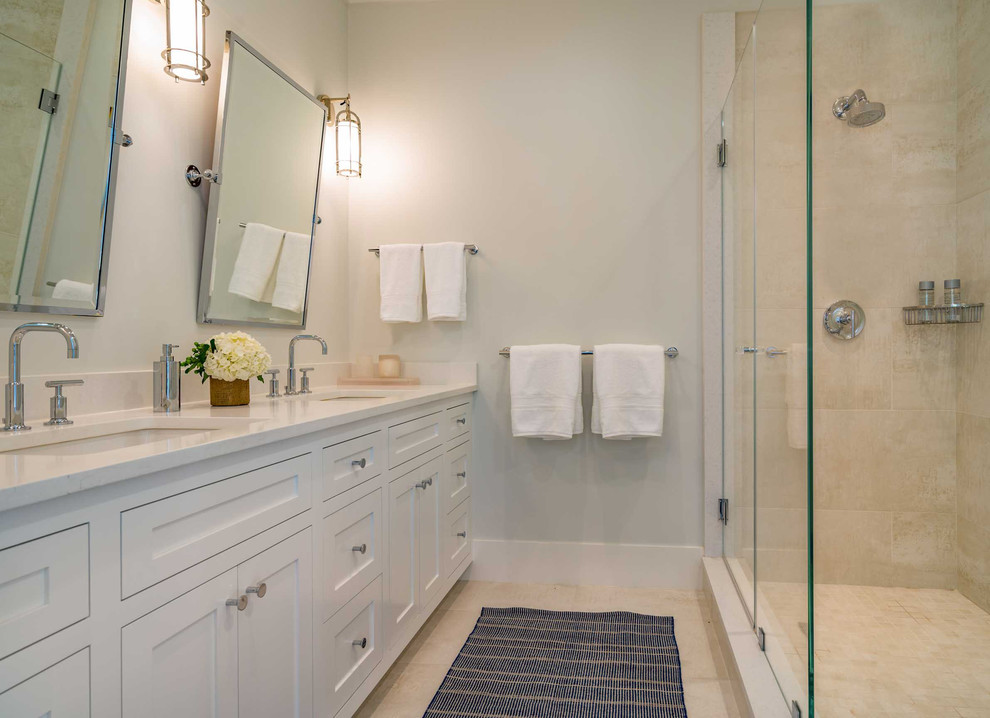 Inspiration for a mid-sized transitional 3/4 bathroom in Boston with raised-panel cabinets, white cabinets, an open shower, a one-piece toilet, white tile, ceramic tile, beige walls, ceramic floors, a drop-in sink, soapstone benchtops, beige floor and an open shower.
