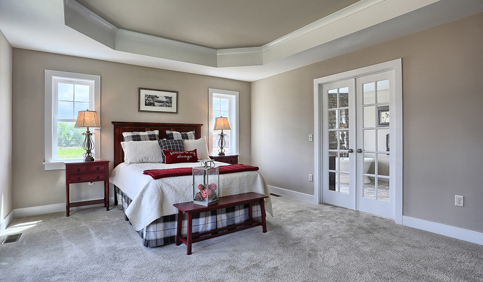 This is an example of a large arts and crafts master bedroom in Other with carpet, no fireplace and beige walls.