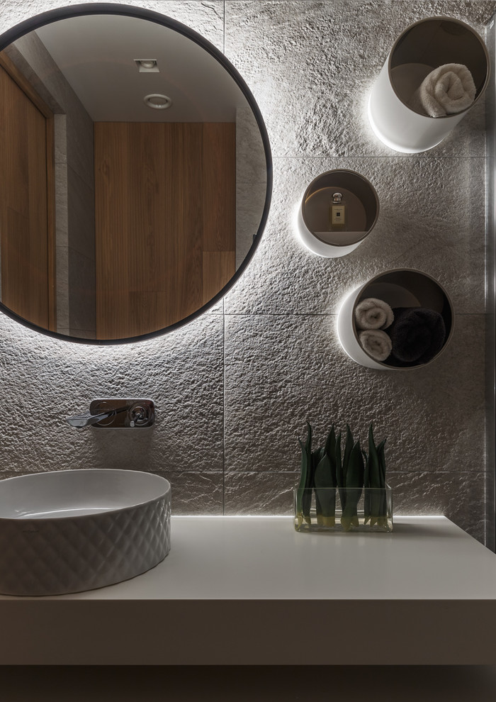 This is an example of a mid-sized contemporary bathroom in Moscow with flat-panel cabinets, white cabinets, beige tile, porcelain tile, a vessel sink and engineered quartz benchtops.