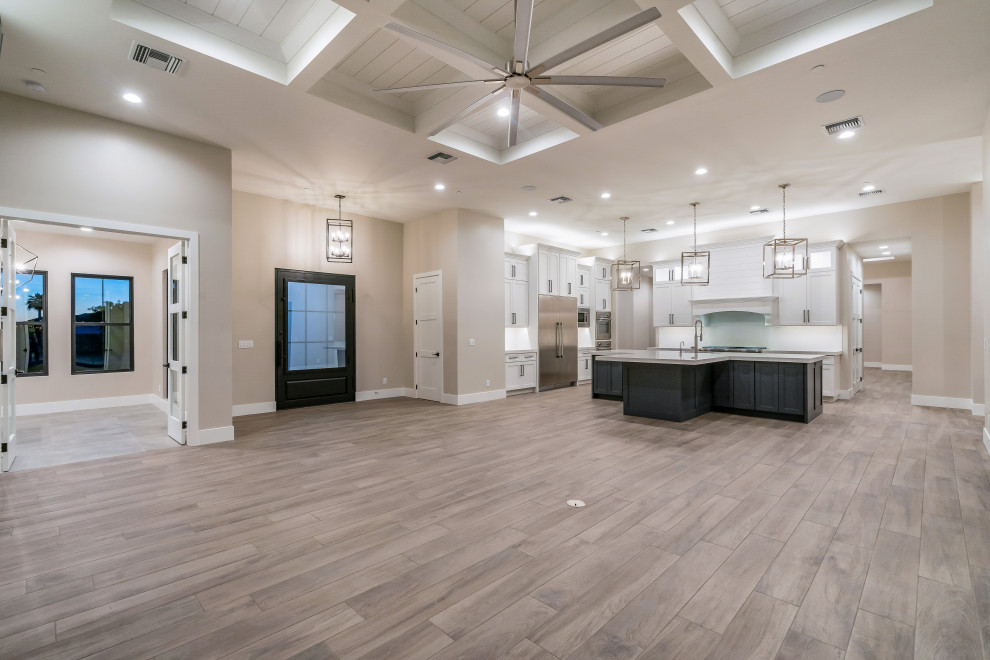 Large minimalist u-shaped open concept kitchen photo in Phoenix with an island
