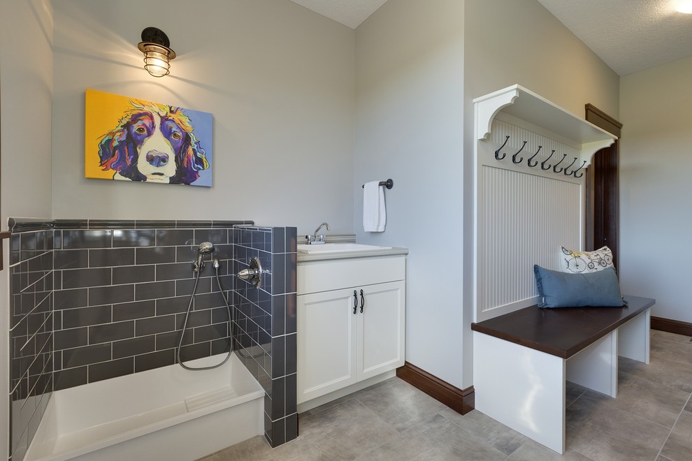 Traditional utility room in Minneapolis with a drop-in sink, recessed-panel cabinets, white cabinets and grey walls.