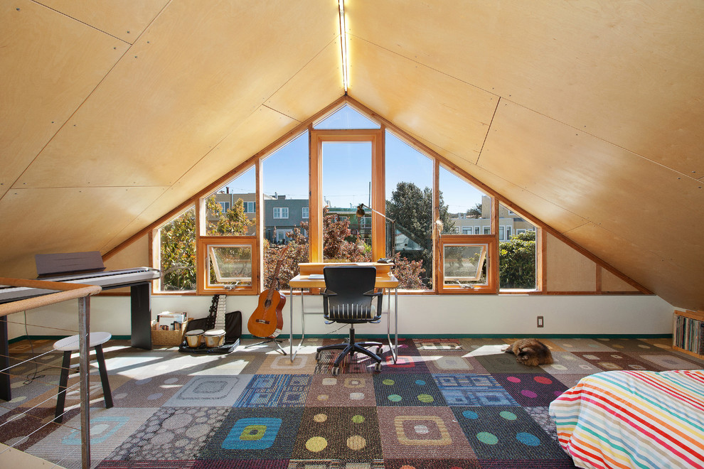 This is an example of a contemporary loft-style bedroom in San Francisco with carpet.