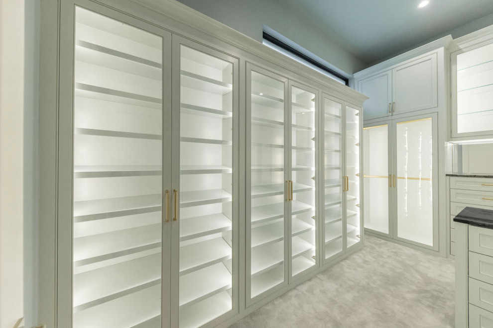 Large traditional gender neutral walk-in wardrobe in Dallas with beaded cabinets, grey cabinets, carpet and grey floors.
