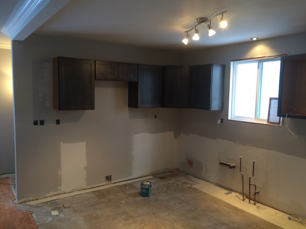 Inspiration for a mid-sized transitional u-shaped porcelain tile and white floor eat-in kitchen remodel with a double-bowl sink, shaker cabinets, gray cabinets, laminate countertops, gray backsplash, stainless steel appliances and a peninsula