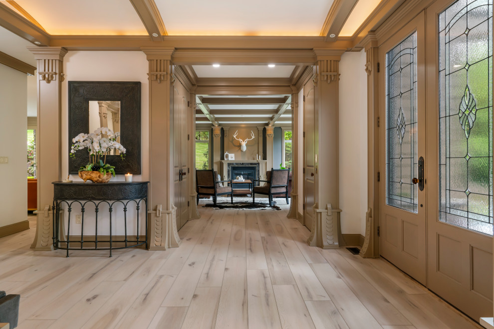 Design ideas for a large traditional front door in Seattle with white walls, vinyl floors, a double front door, a brown front door, beige floor and coffered.