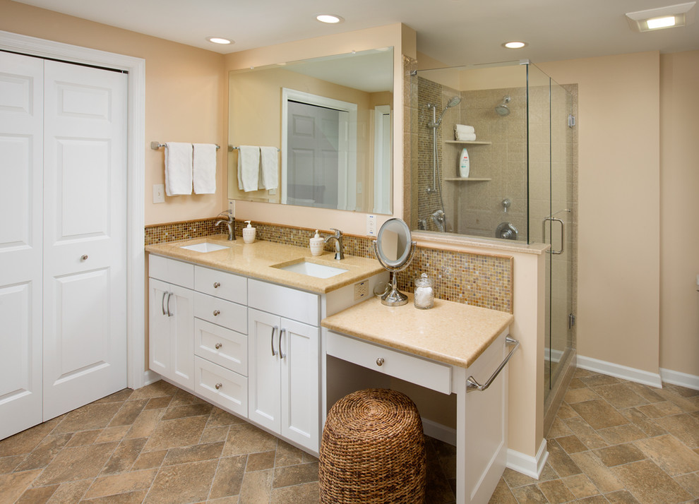 This is an example of a mid-sized transitional master bathroom in Columbus with an undermount sink, shaker cabinets, beige cabinets, quartzite benchtops, an alcove shower, a two-piece toilet, brown tile, glass sheet wall, beige walls and vinyl floors.