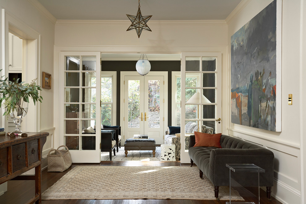 Inspiration for a traditional foyer in Minneapolis with white walls and dark hardwood floors.