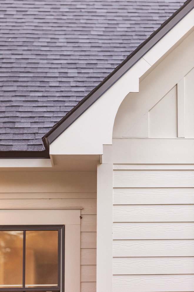 Home design - large transitional two-story concrete fiberboard beige home design idea with a shingle roof