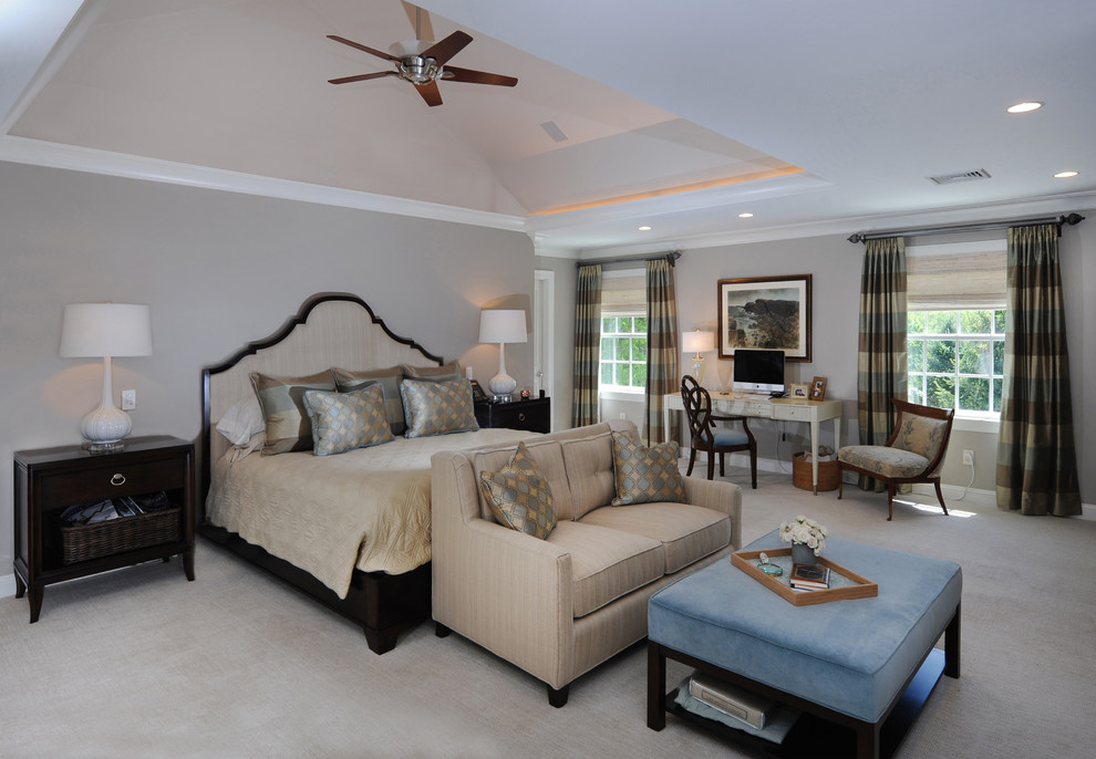 This is an example of a large transitional master bedroom in Boston with grey walls, carpet, beige floor and no fireplace.