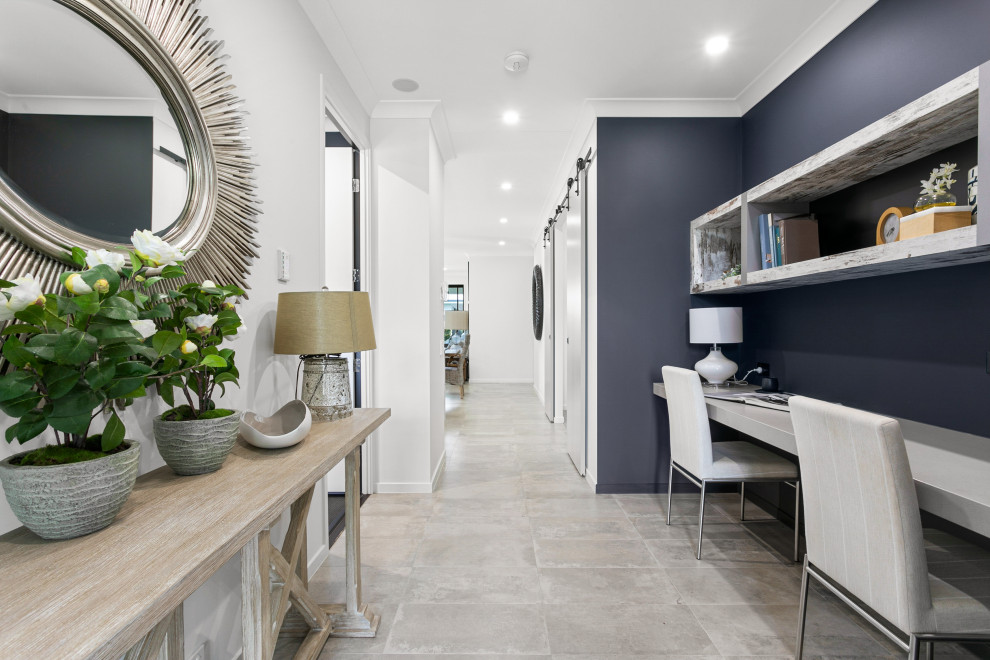 Inspiration for a small beach style home office in Sunshine Coast with a built-in desk.