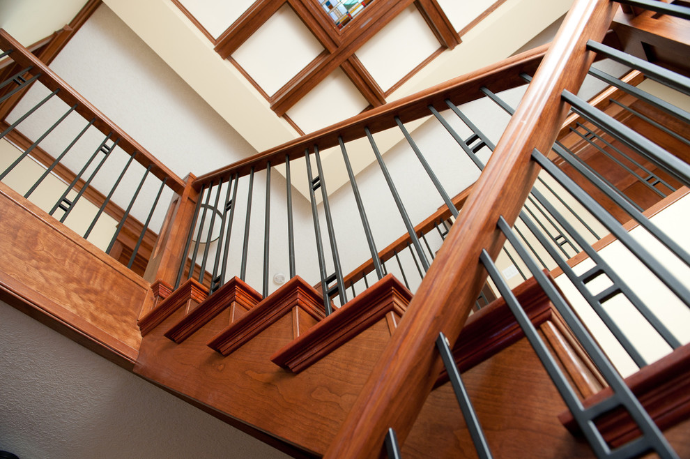 Arts and crafts wood staircase in Edmonton with wood risers and mixed railing.