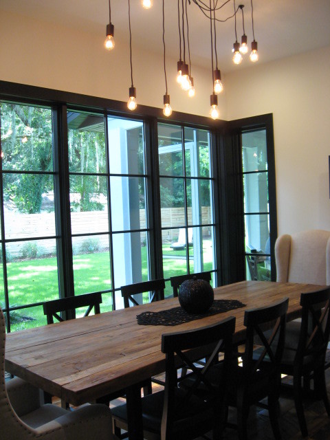 Photo of a mid-sized country kitchen/dining combo in Orlando with white walls.
