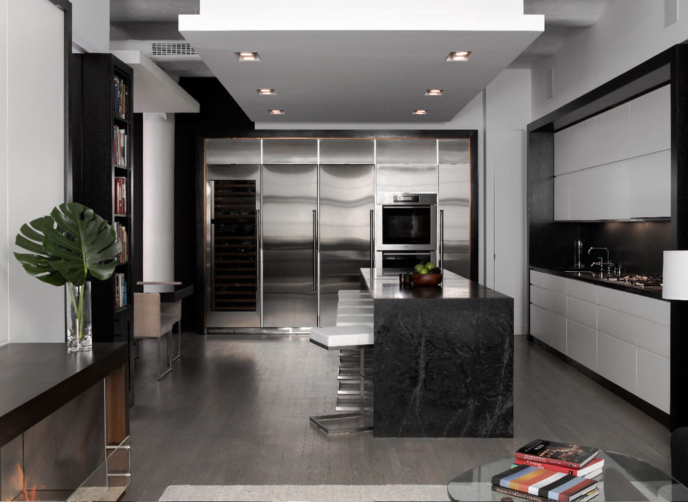 This is an example of a modern kitchen in Other with flat-panel cabinets, white cabinets and soapstone benchtops.