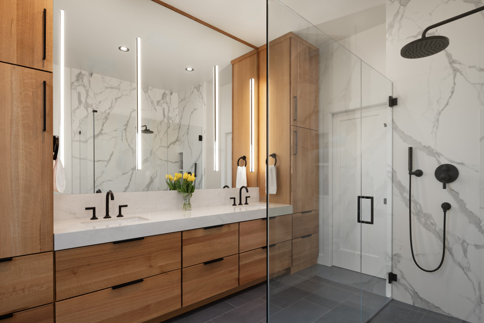 Bathroom - large transitional master white tile and stone slab porcelain tile, gray floor and double-sink bathroom idea in San Francisco with flat-panel cabinets, light wood cabinets, an undermount sink, quartz countertops, a hinged shower door, white countertops and a built-in vanity