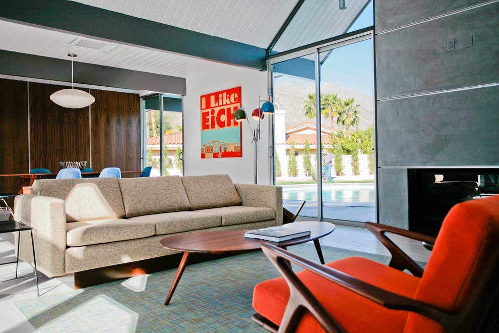 Photo of a mid-sized midcentury formal open concept living room in Los Angeles with white walls, porcelain floors, a standard fireplace, a concrete fireplace surround and no tv.