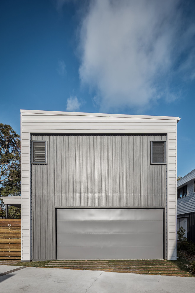 Photo of a beach style attached two-car garage in Gold Coast - Tweed.