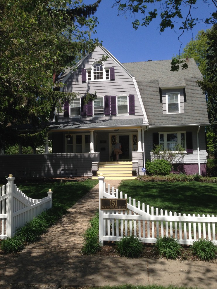 This is an example of a large transitional three-storey purple exterior in New York with wood siding.