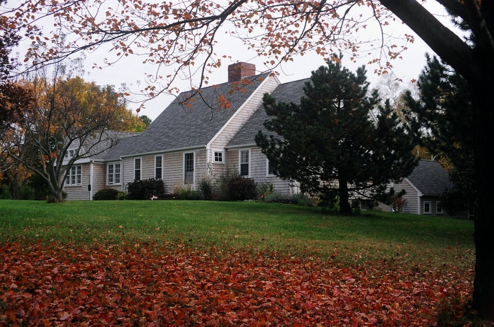 Photo of a traditional two-storey exterior in Boston with wood siding.