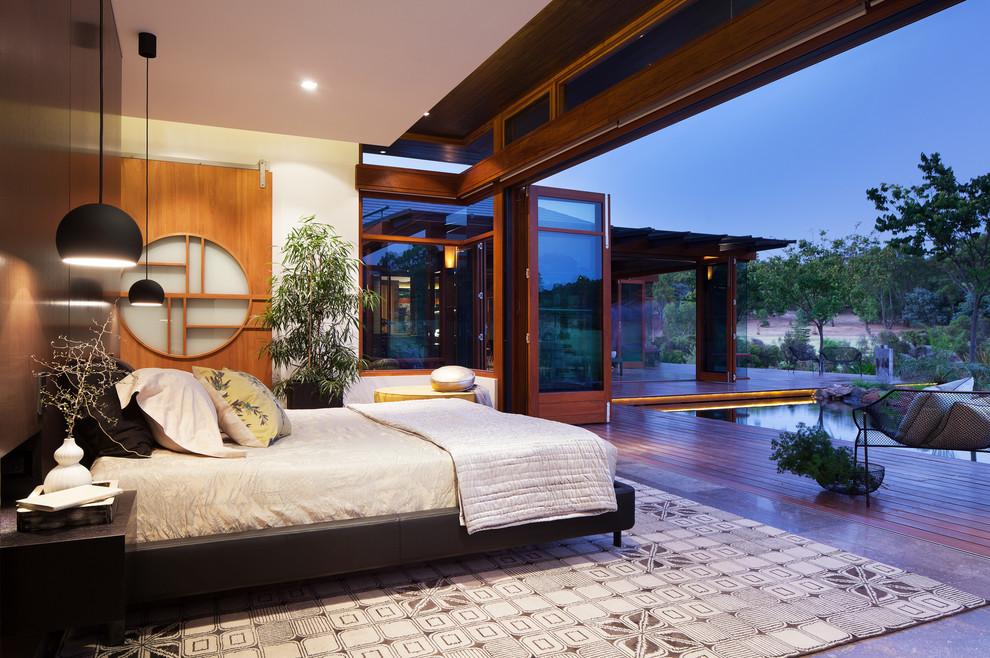 Design ideas for a large asian master bedroom in Perth with white walls.