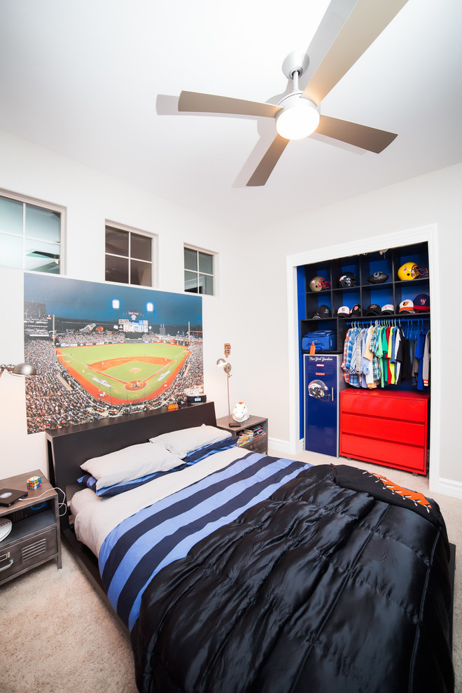This is an example of a modern kids' room for boys in Sacramento with blue walls.