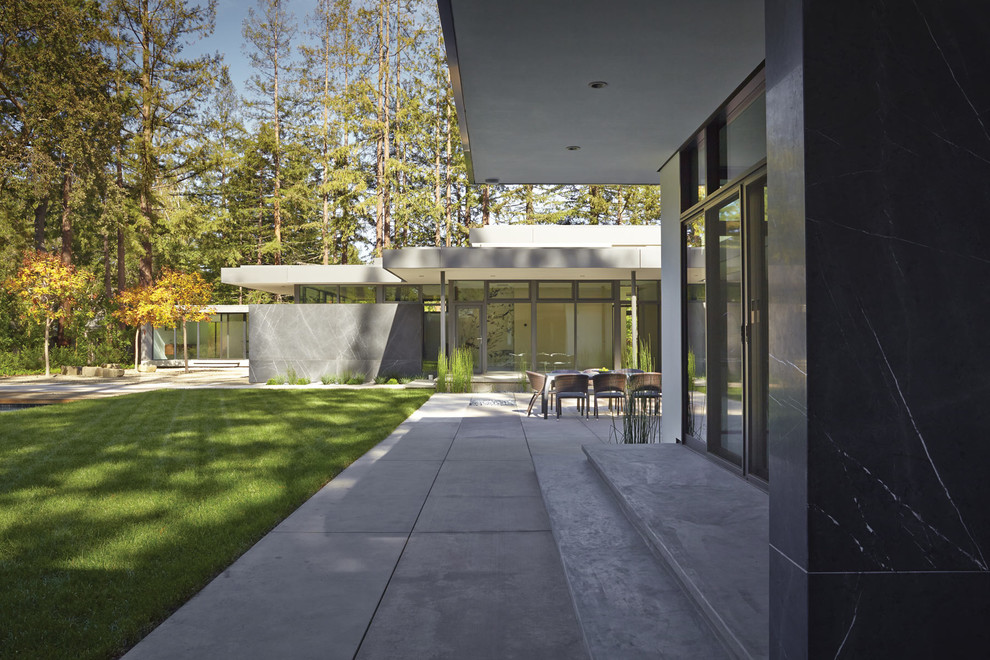 Inspiration for an expansive contemporary one-storey stucco white exterior in San Francisco with a flat roof.