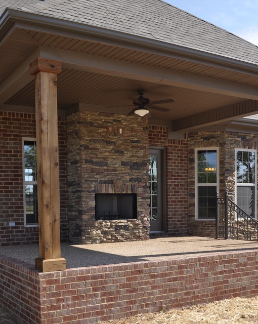 Exterior Stone Fireplace and Cedar Posts Contemporary Veranda