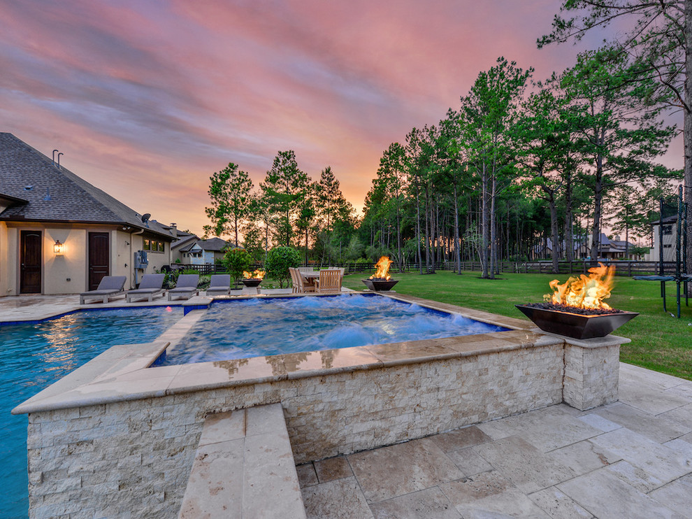 Large transitional backyard stone and rectangular natural hot tub photo in Houston