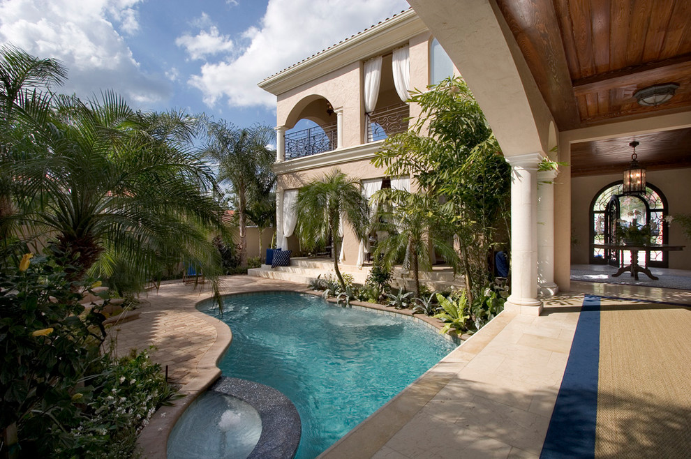 This is an example of a mediterranean courtyard custom-shaped pool in Orlando.