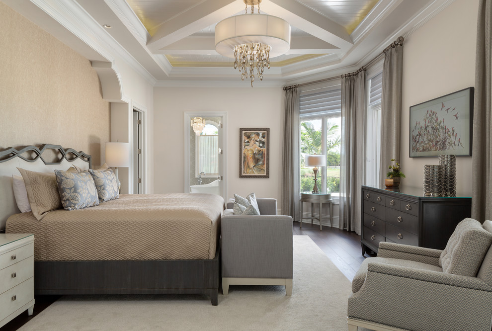 Large mediterranean master bedroom in Miami with beige walls, dark hardwood floors and no fireplace.