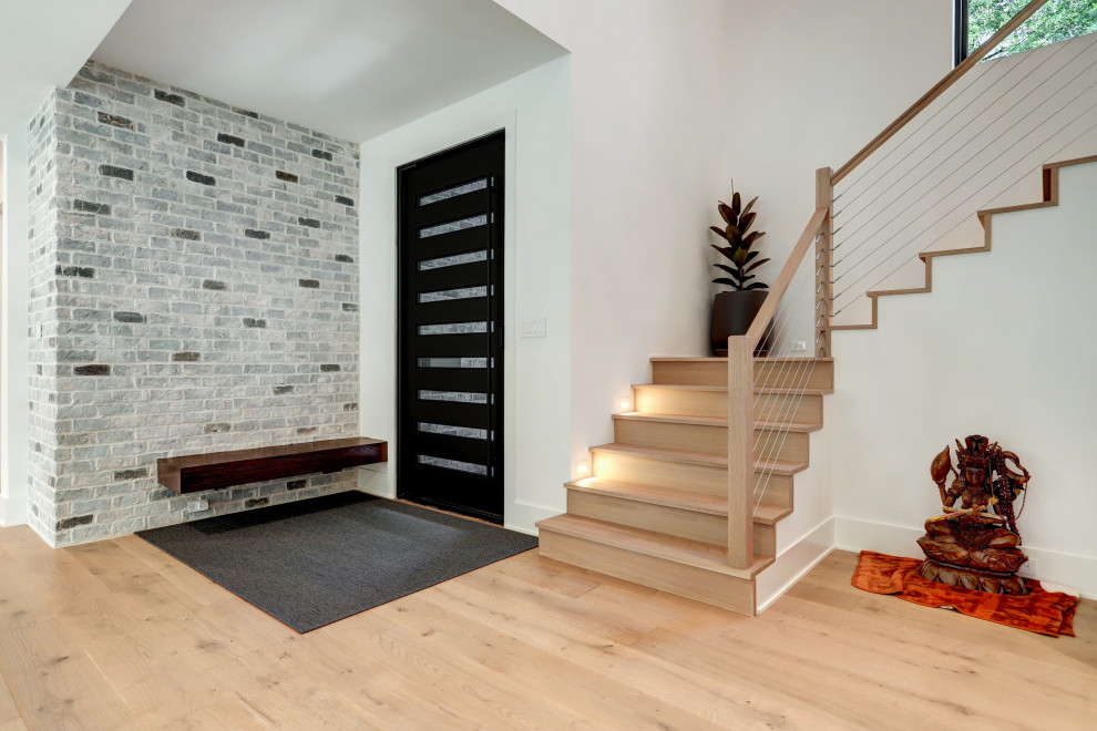 Example of a transitional home design design in Houston