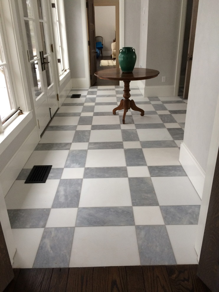 Mid-sized country entryway in New York with grey walls, marble floors and multi-coloured floor.