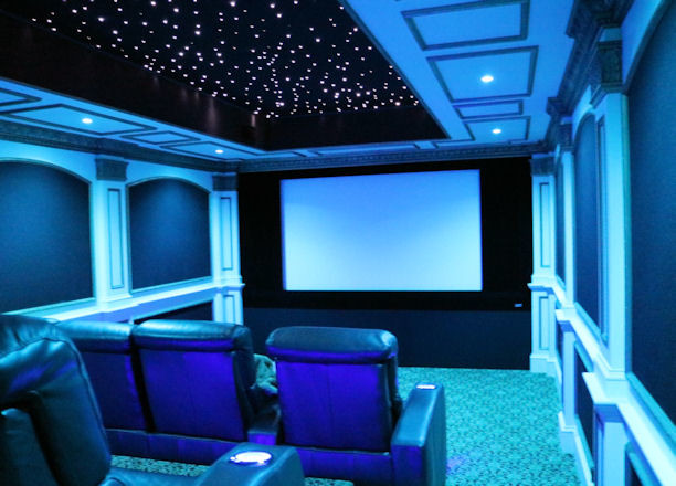 Design ideas for a mid-sized modern enclosed home theatre in Boston with carpet and a projector screen.
