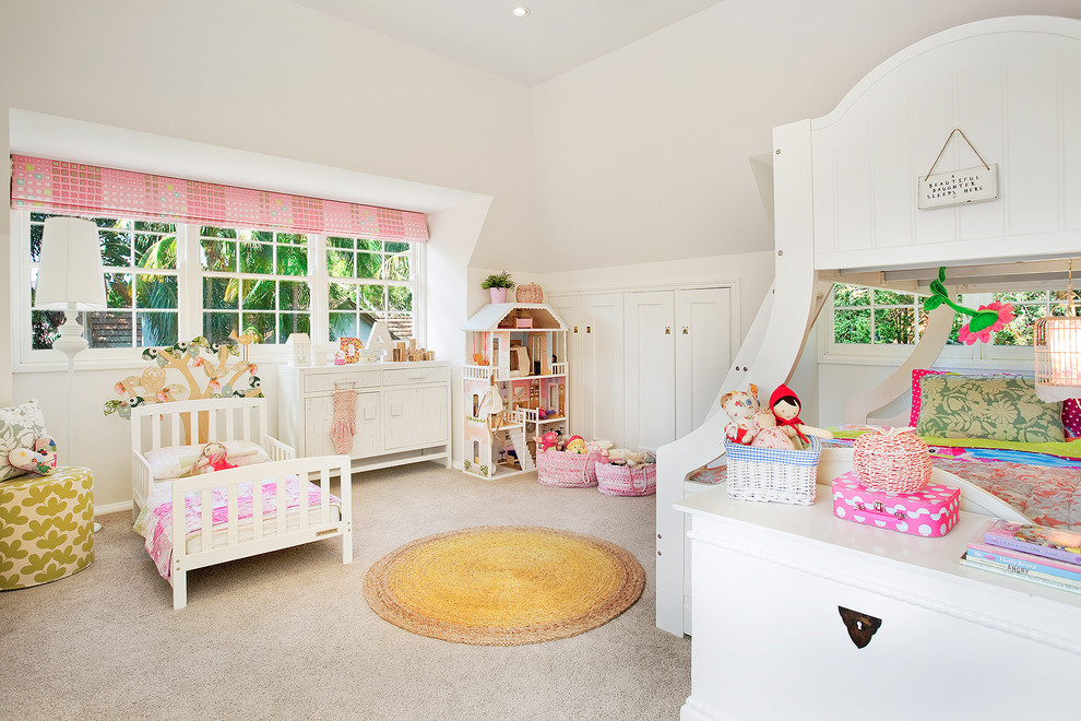 Inspiration for a traditional kids' bedroom for kids 4-10 years old and girls in Los Angeles with white walls and carpet.
