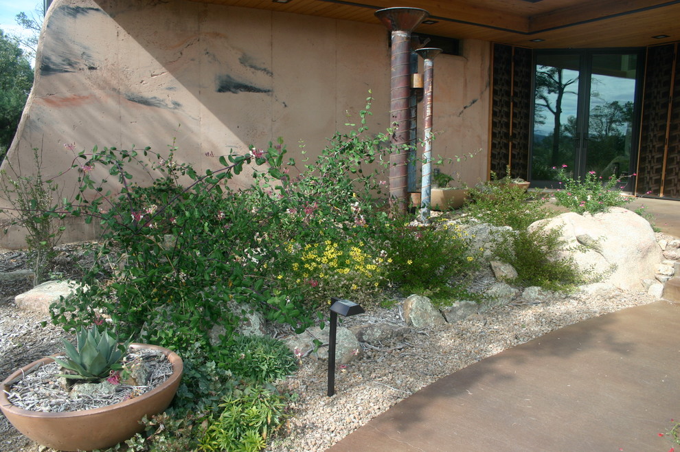 Inspiration for a mid-sized front door remodel in Phoenix with a glass front door