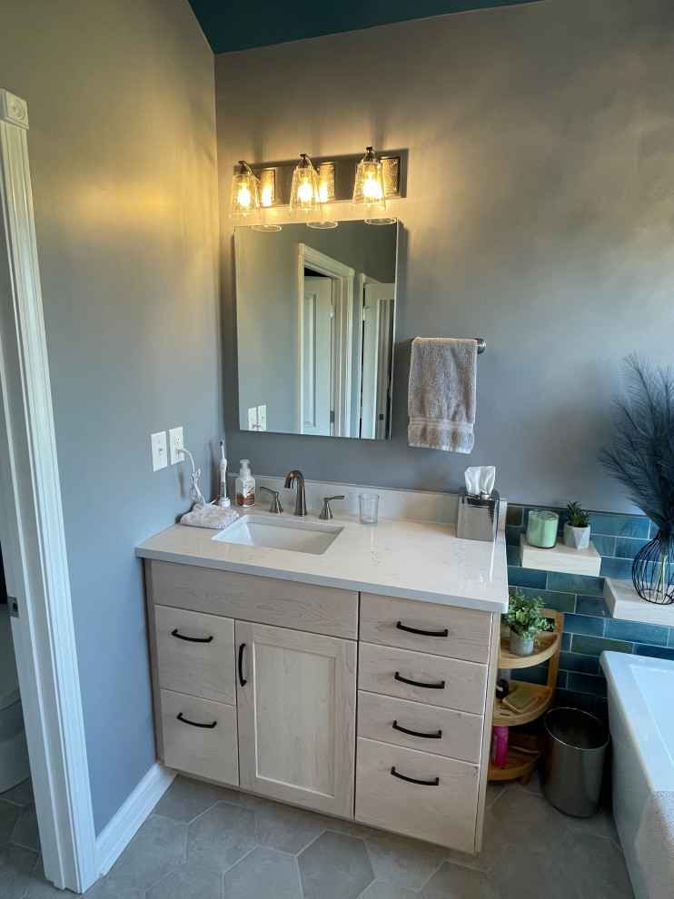 Inspiration for a master blue tile and subway tile ceramic tile, gray floor and double-sink freestanding bathtub remodel with shaker cabinets, light wood cabinets, a bidet, gray walls, an undermount sink, quartz countertops, a hinged shower door, white countertops and a built-in vanity