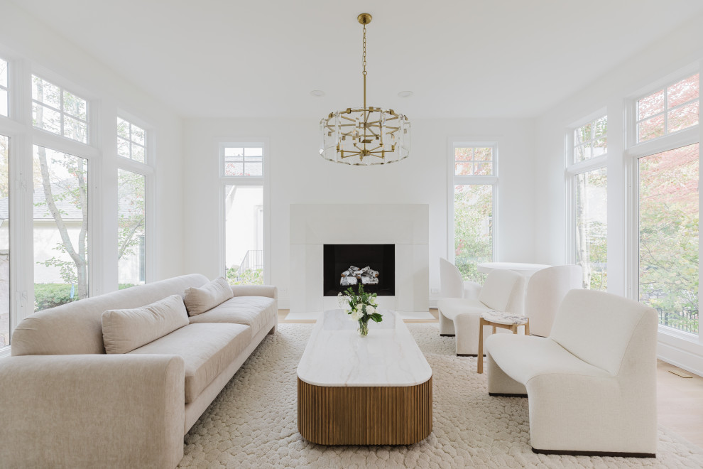 Spacious Modern Living Room with White Furniture and Large Windows