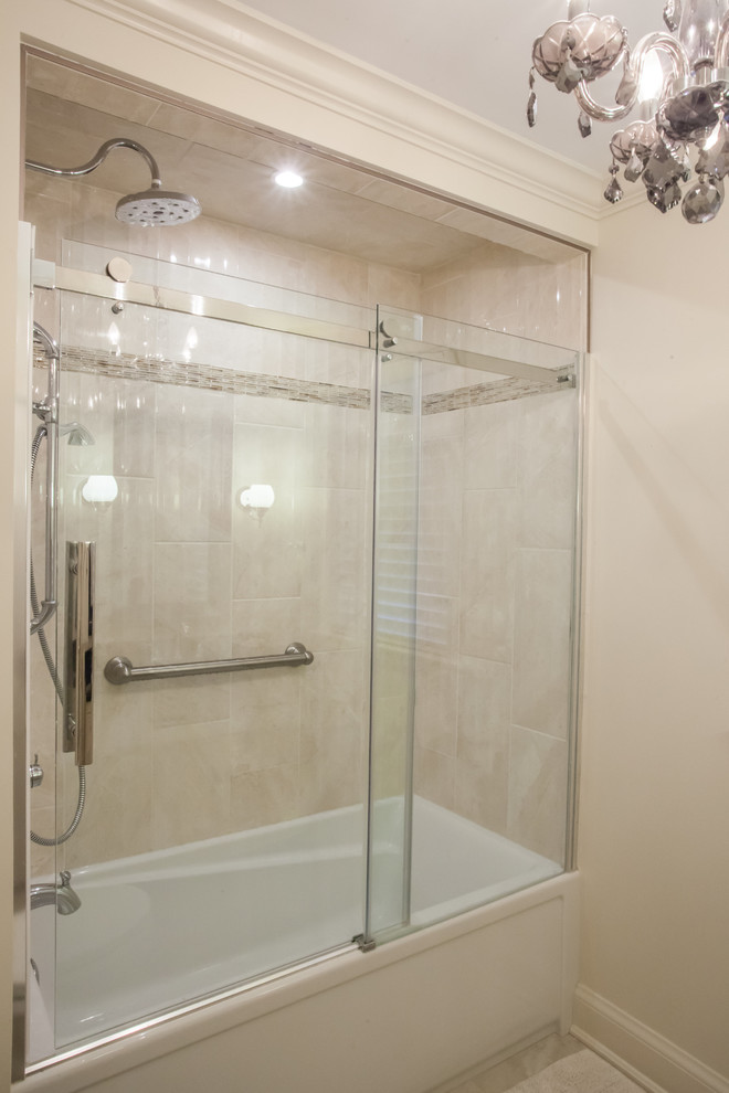 Mid-sized traditional bathroom in Toronto with an undermount sink, recessed-panel cabinets, white cabinets, granite benchtops, an alcove tub, a shower/bathtub combo, a two-piece toilet, beige tile, porcelain tile, white walls and porcelain floors.